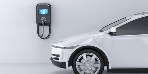 white vehicle being charged at an electric vehicle charging station 